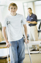 Patient using crutches during knee rehabilitation