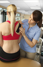 Therapist evaluating shoulder movement